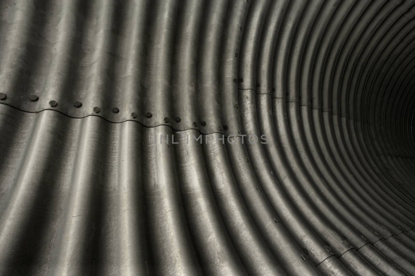 An abstract image of steel plate used for tunnels.
