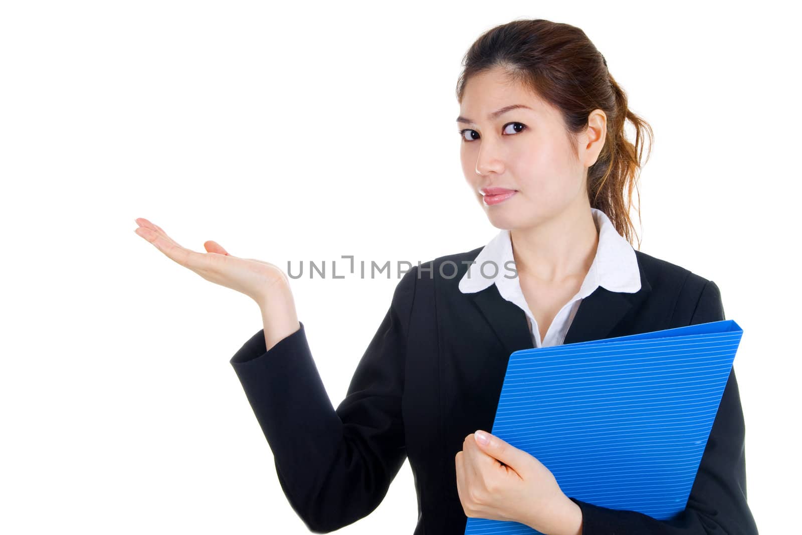 Portrait of a beautiful young businesswoman, holding out her hand as displaying something. Ready for you to add text. 
