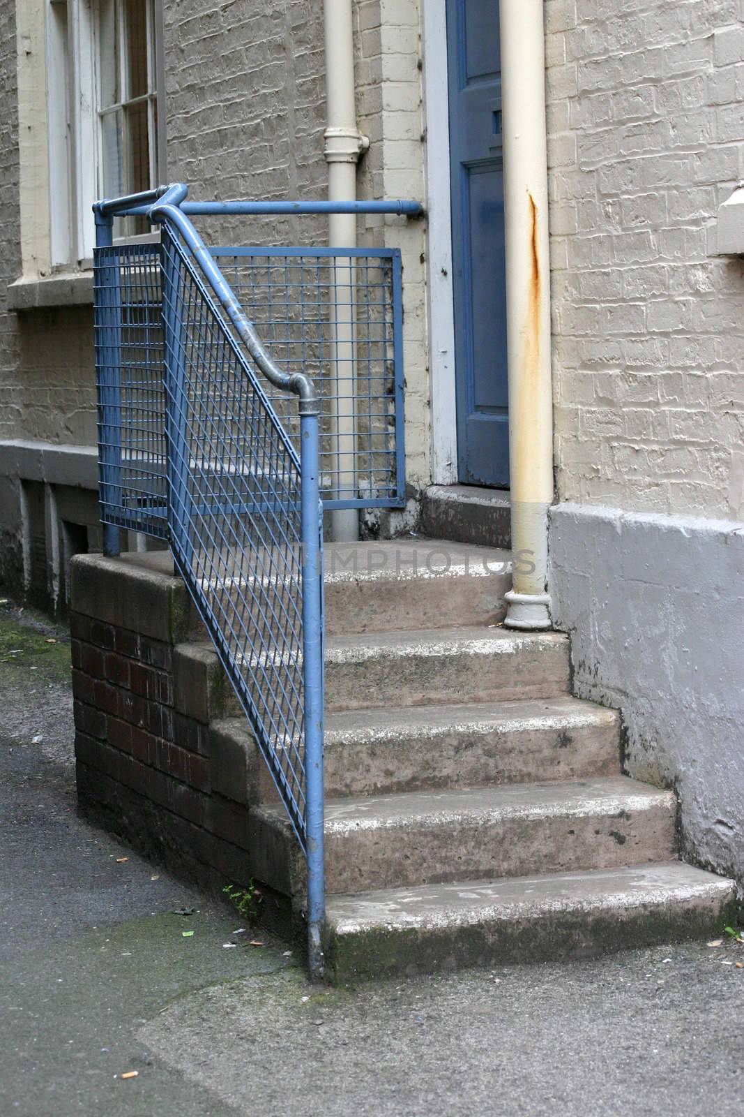 The Steps to the Back Door of a Building