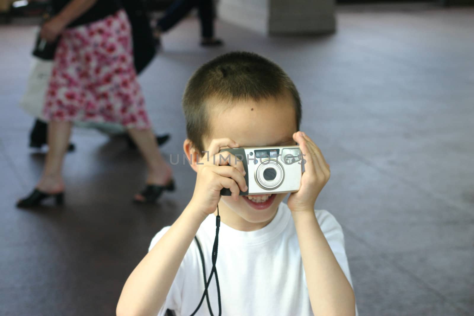 Boy Taking Photo of Dad