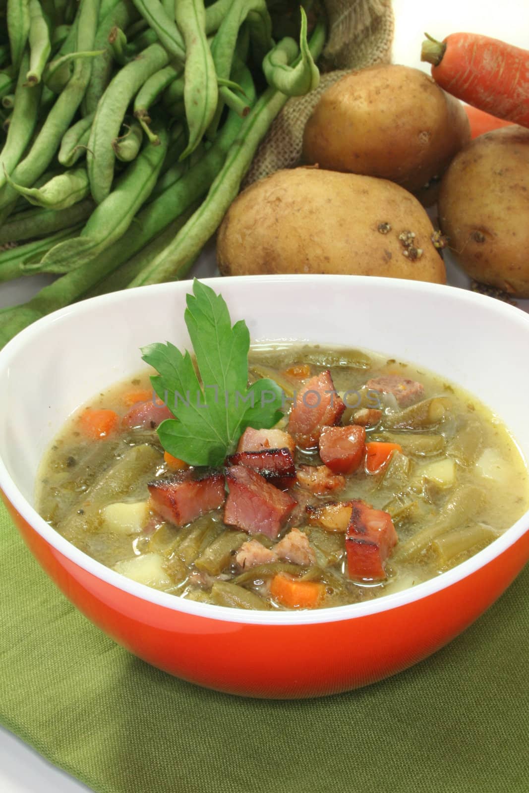 Bean soup with roasted bacon and lovage