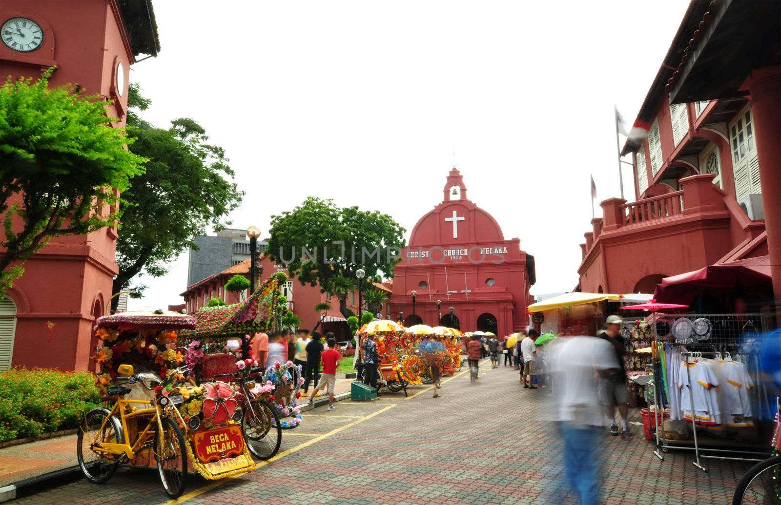 Tourist activity in front Christ Church. Christ Church is in the main square adjacent to Stadthuys, Melaka, Malaysia.