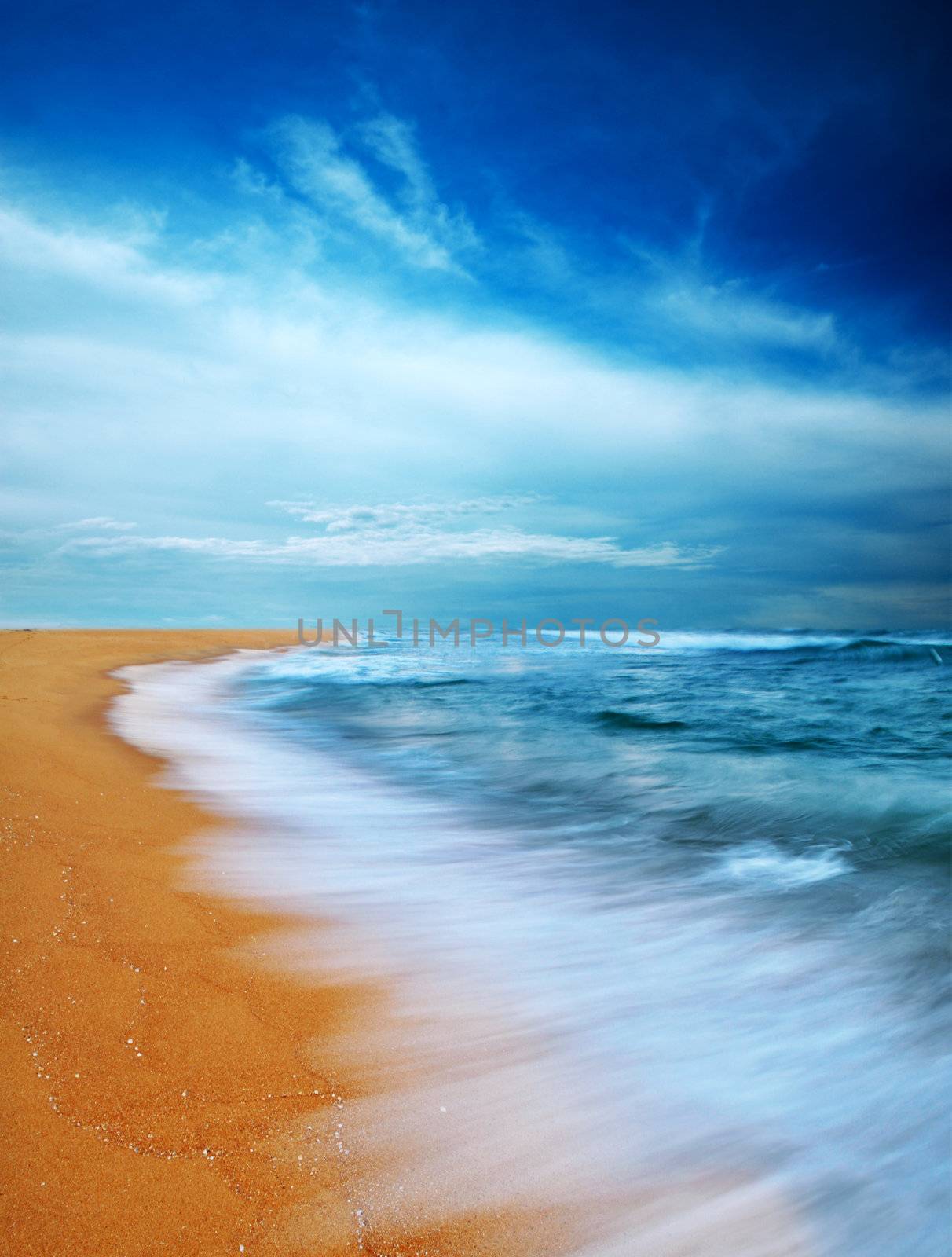 Moody sky and beach, slow shutter. 