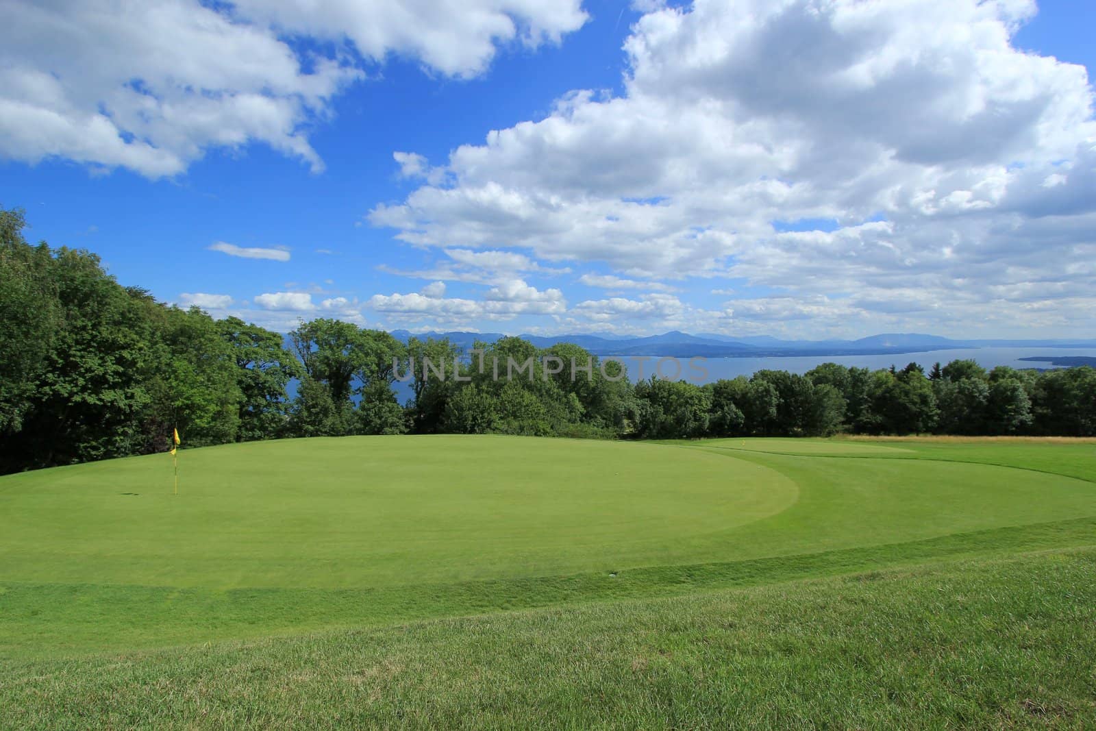 Golf course by Geneva lake by cloudy weather, Switzerland