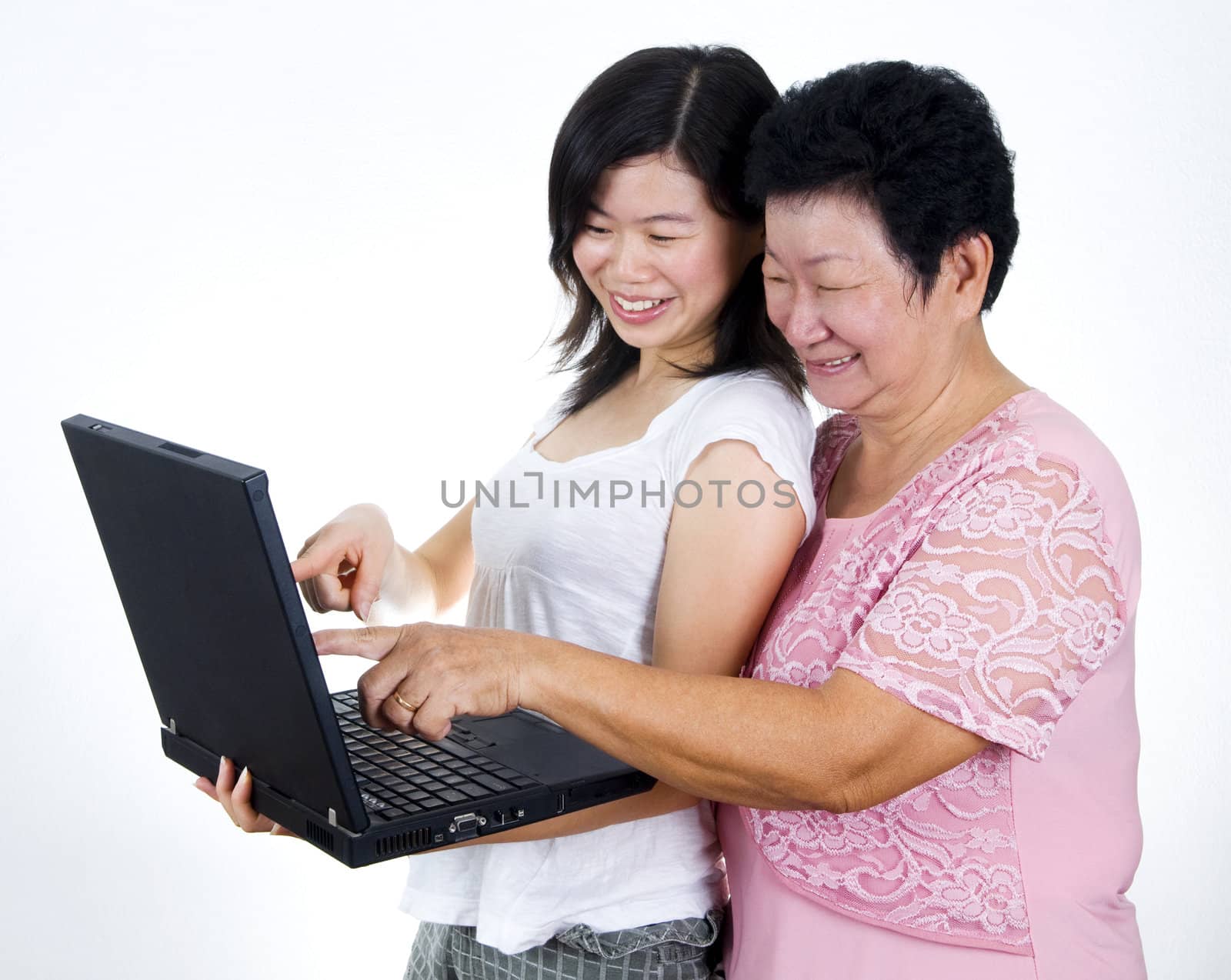 Senior mother and daughter sharing informations from internet.