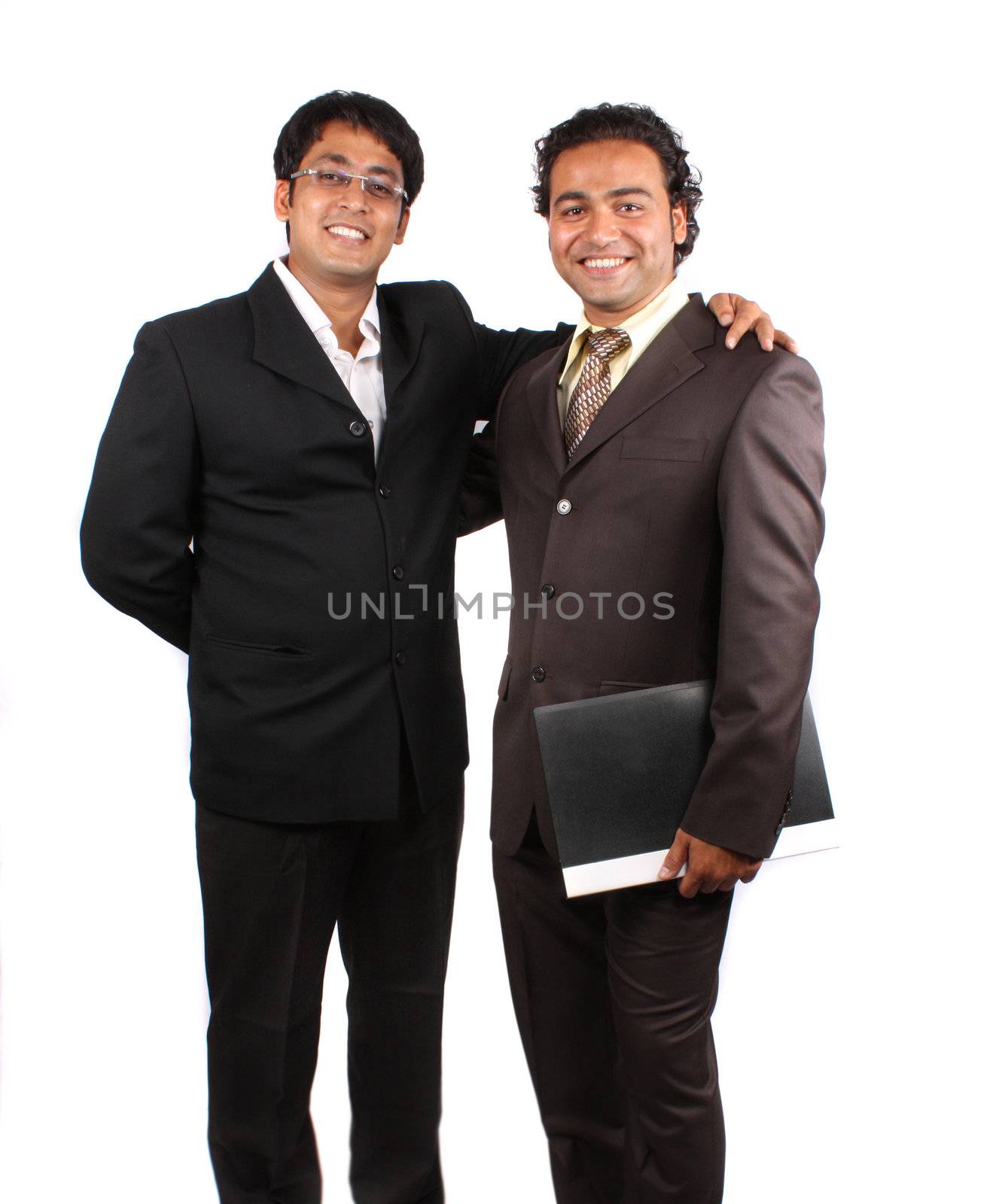 A portrait of happy Indian business partners after a successful deal.