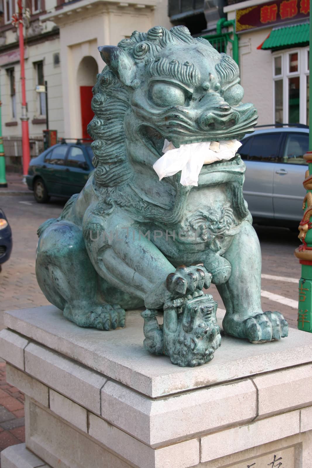 Chinese Lion with Takeaway Bag Dumped in Mouth