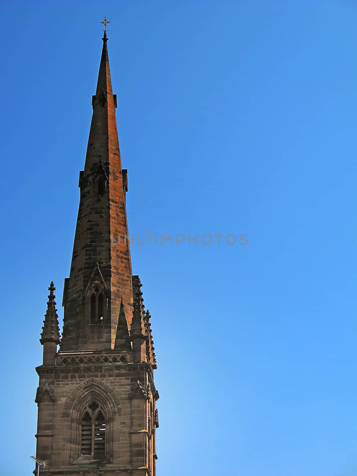 Church Spire in Chester England UK against blue sky in spring