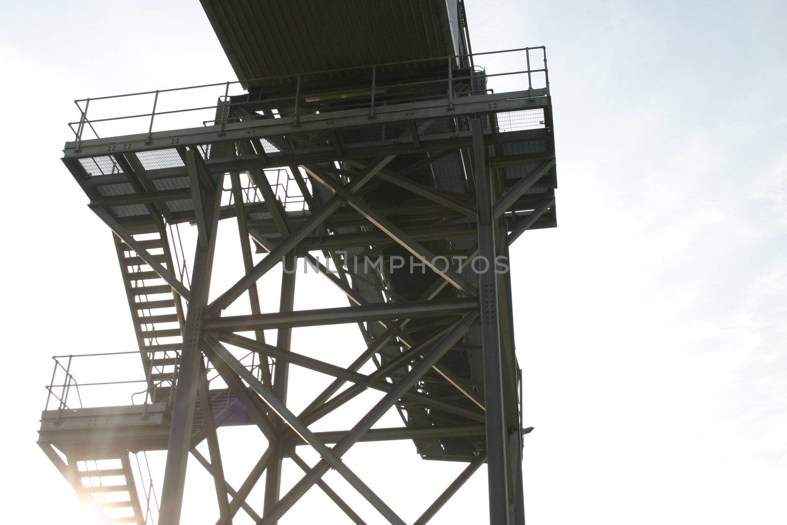 Sunshine Through Steps of Industrial Conveyor by green308