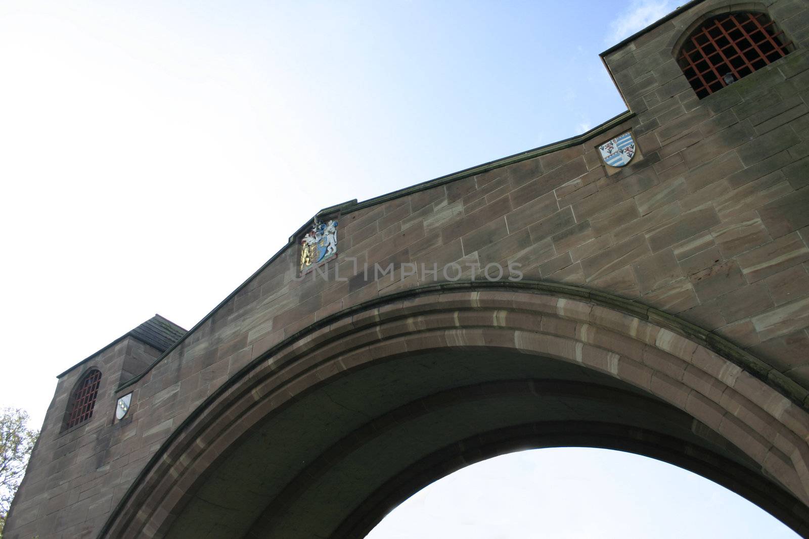 Historic Arched Bidge Joining Two Sections of the Roman Walls Across a Modern Road in Chester England
