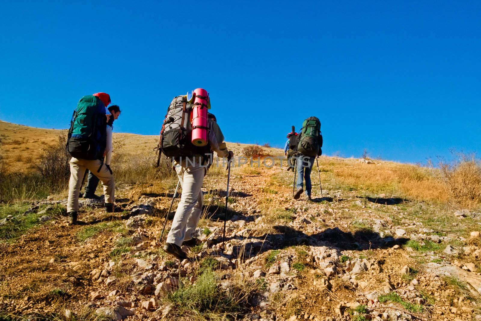 Hikers climbing the mountain by Keetten_Predators