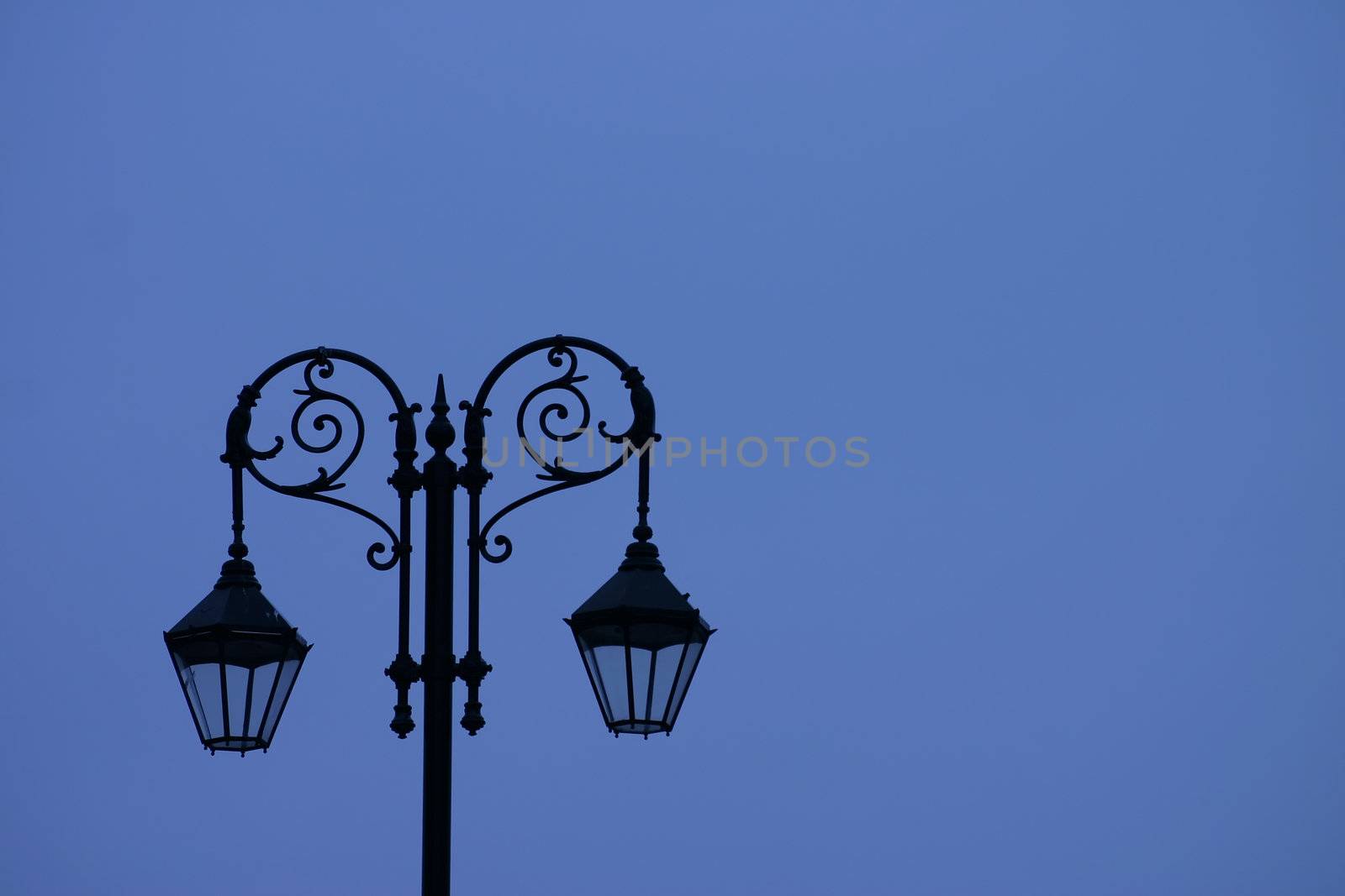 Sihouette of Old Street Light Against Blue Sky
