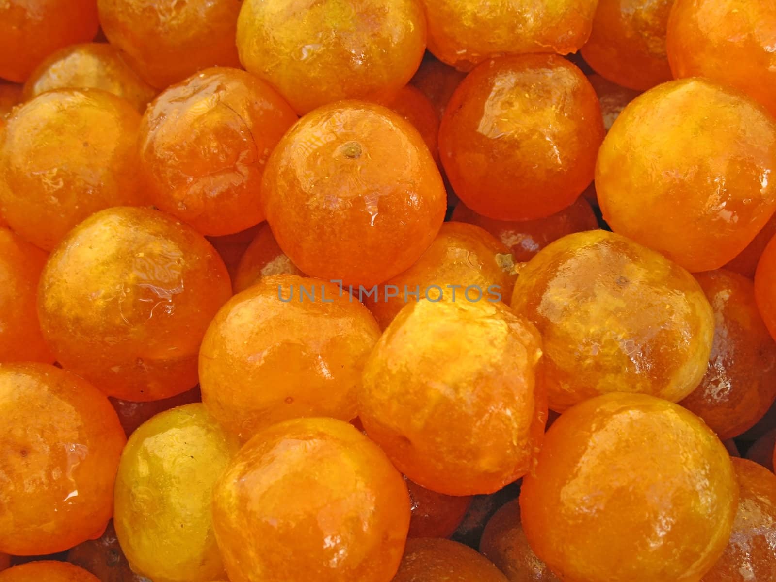 Closeup of Candied Apricots in a Market Tray