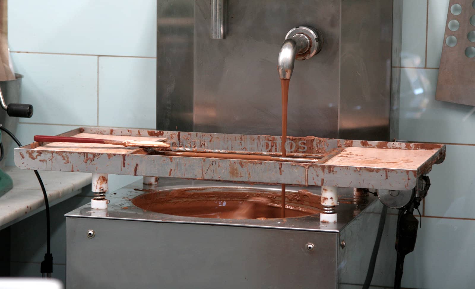 A chocolate making machine inside a chocolate factory.