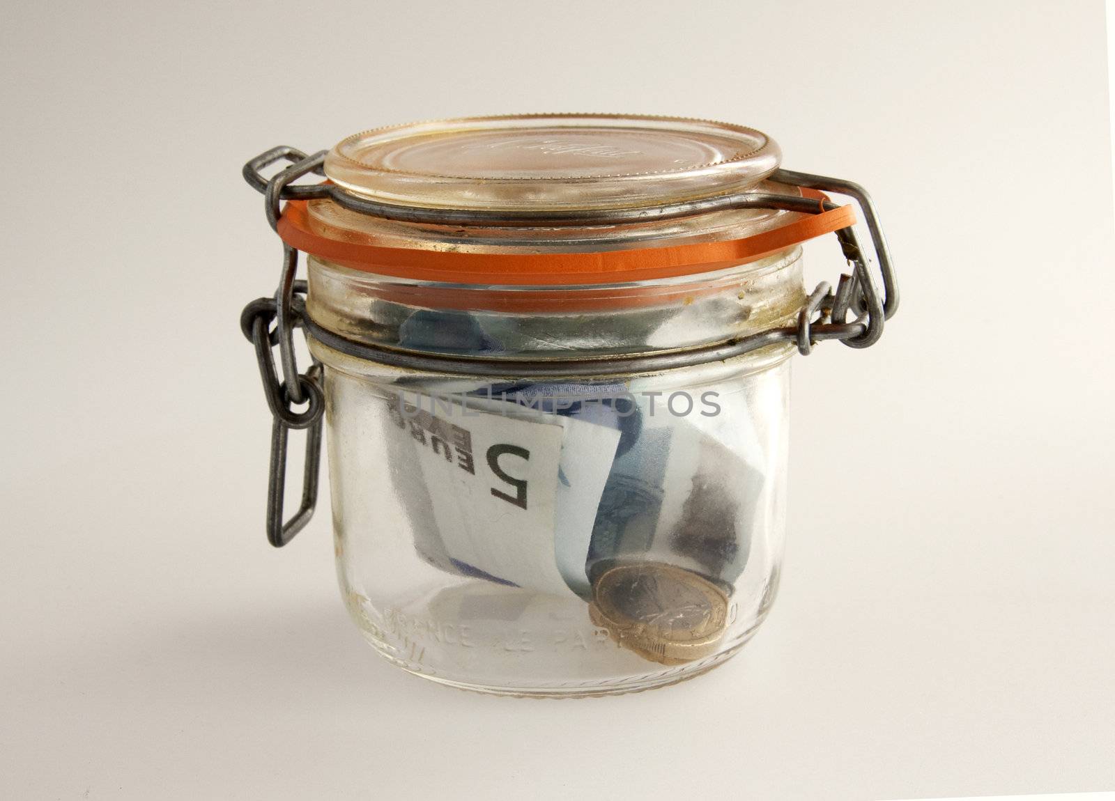 Banknotes and money in a glass jar