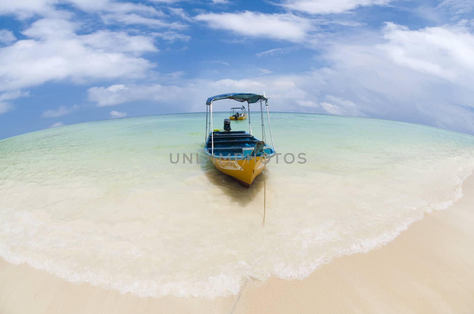 Taxi boat on a tropical beach, Pulau Perhentian, Malaysia.