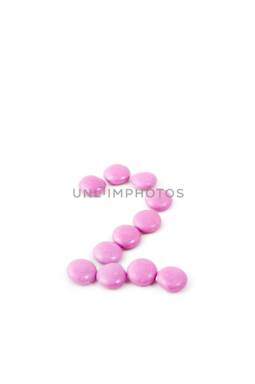 number two made of candies isolated on white
