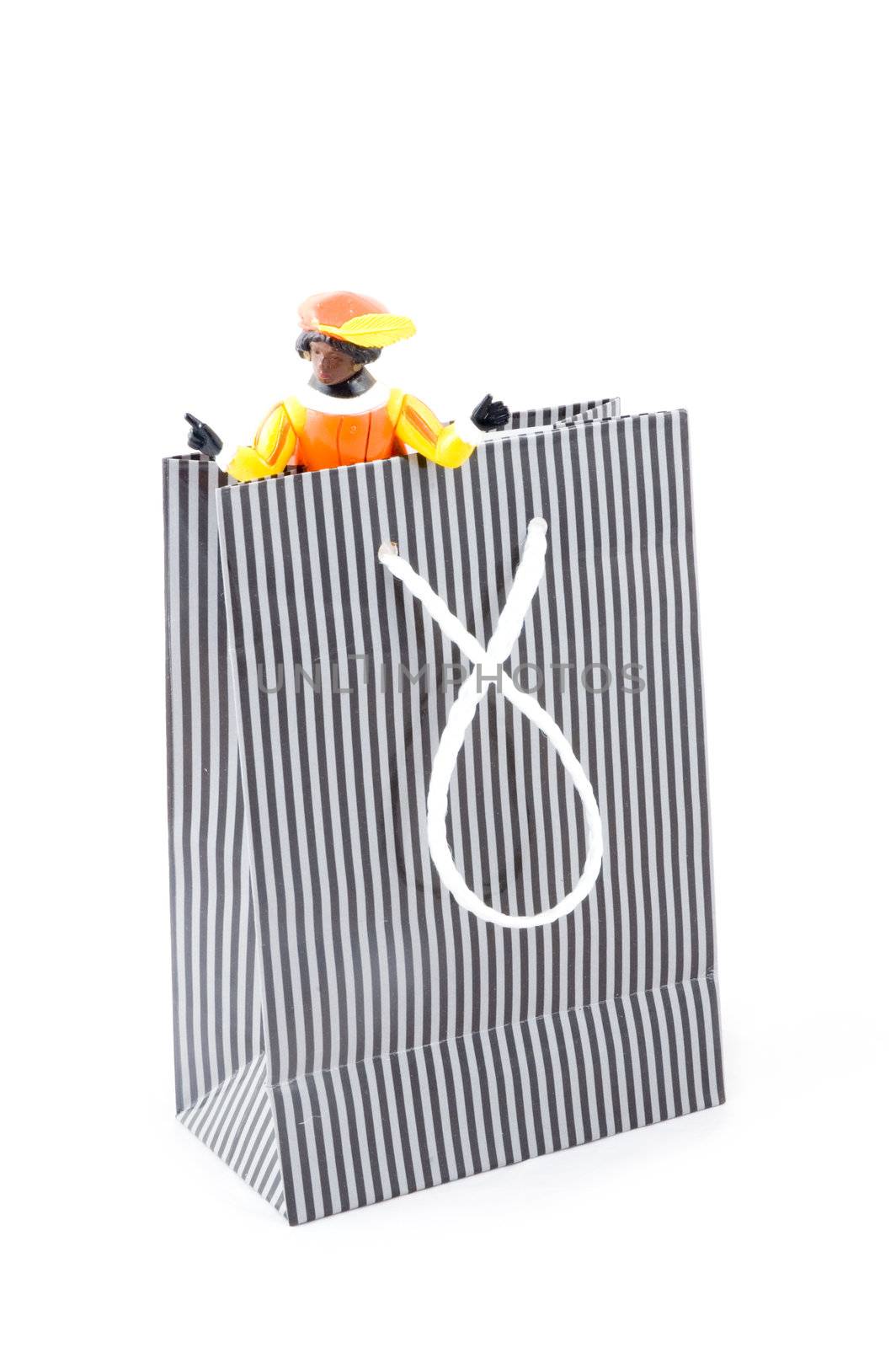 zwarte pieten in a shopping bag, characters from a traditional dutch holiday; isolated on white