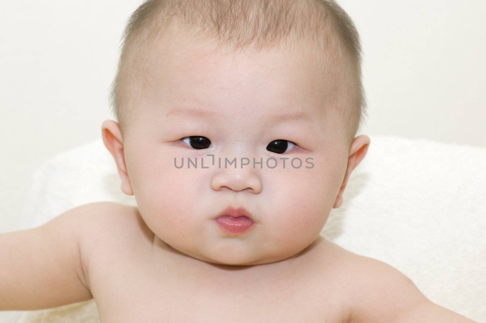 Horizontal portrait of a adorable 6-month-old Asian baby boy 