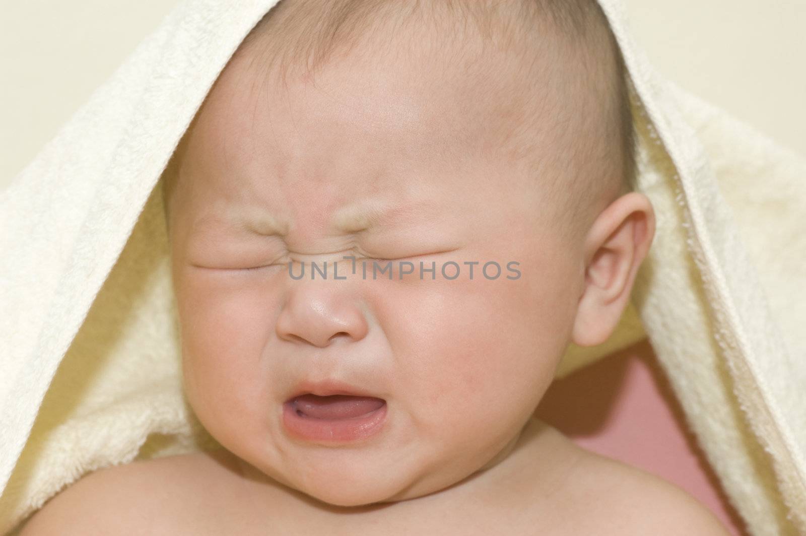 Crying 6 months old Asian baby boy