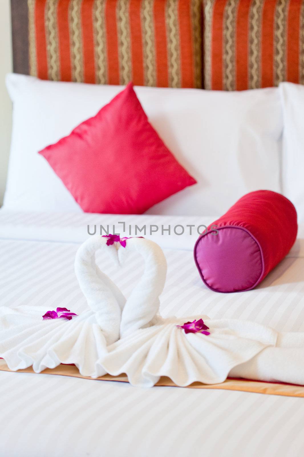 Honeymoon Bed Suite decorated with flowers and swan towels