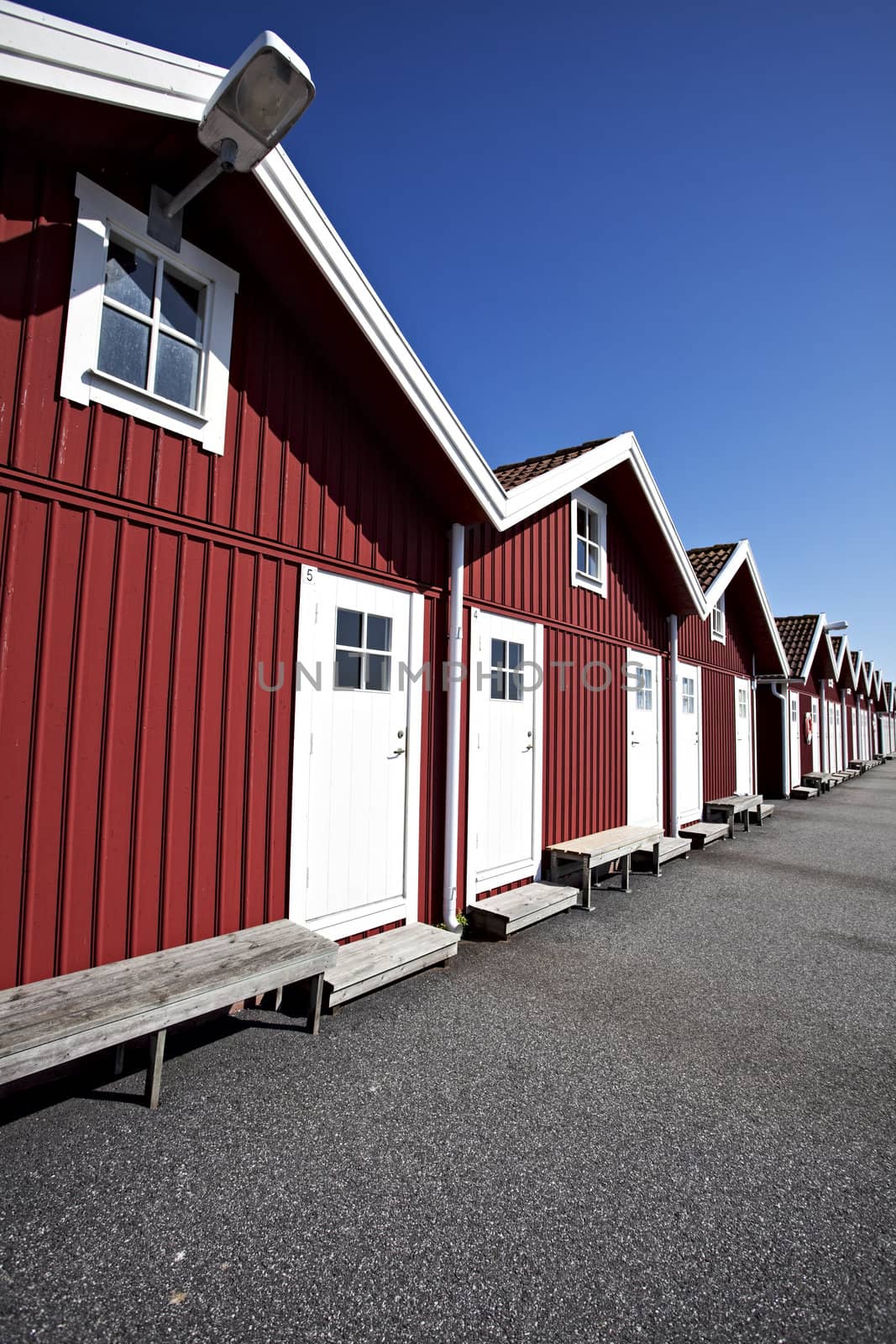 red swedish boat houses on a sunny day