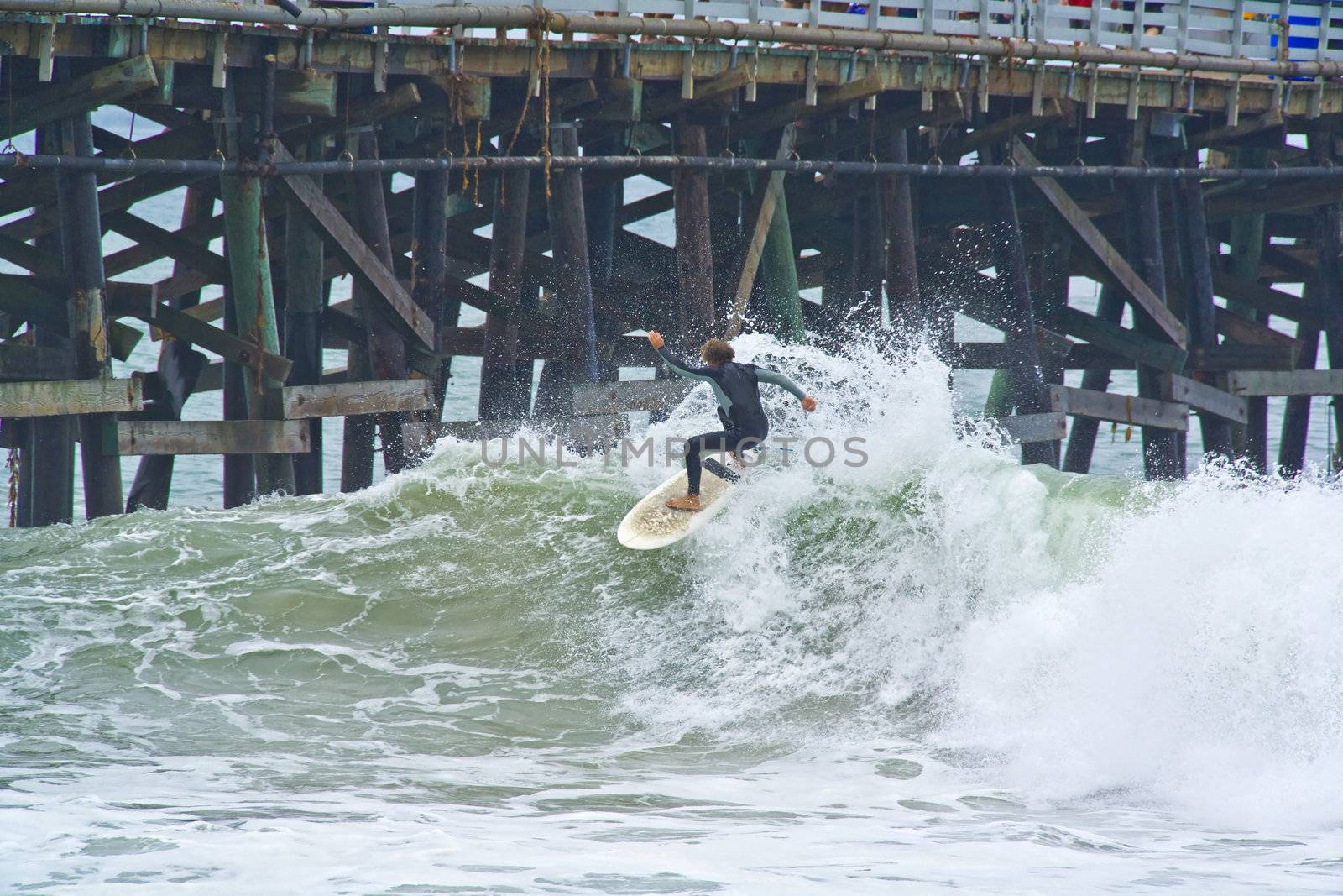 Surfer going off the top of the wave