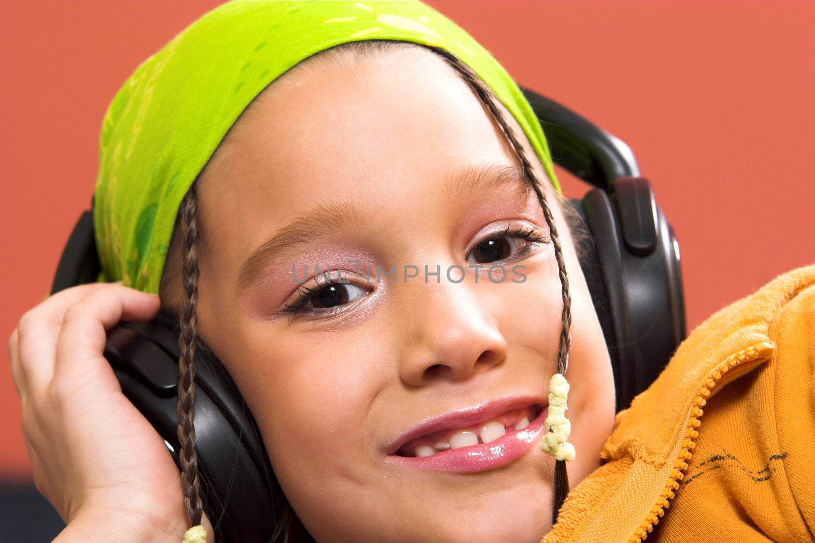 child listening music in headphones by vladacanon