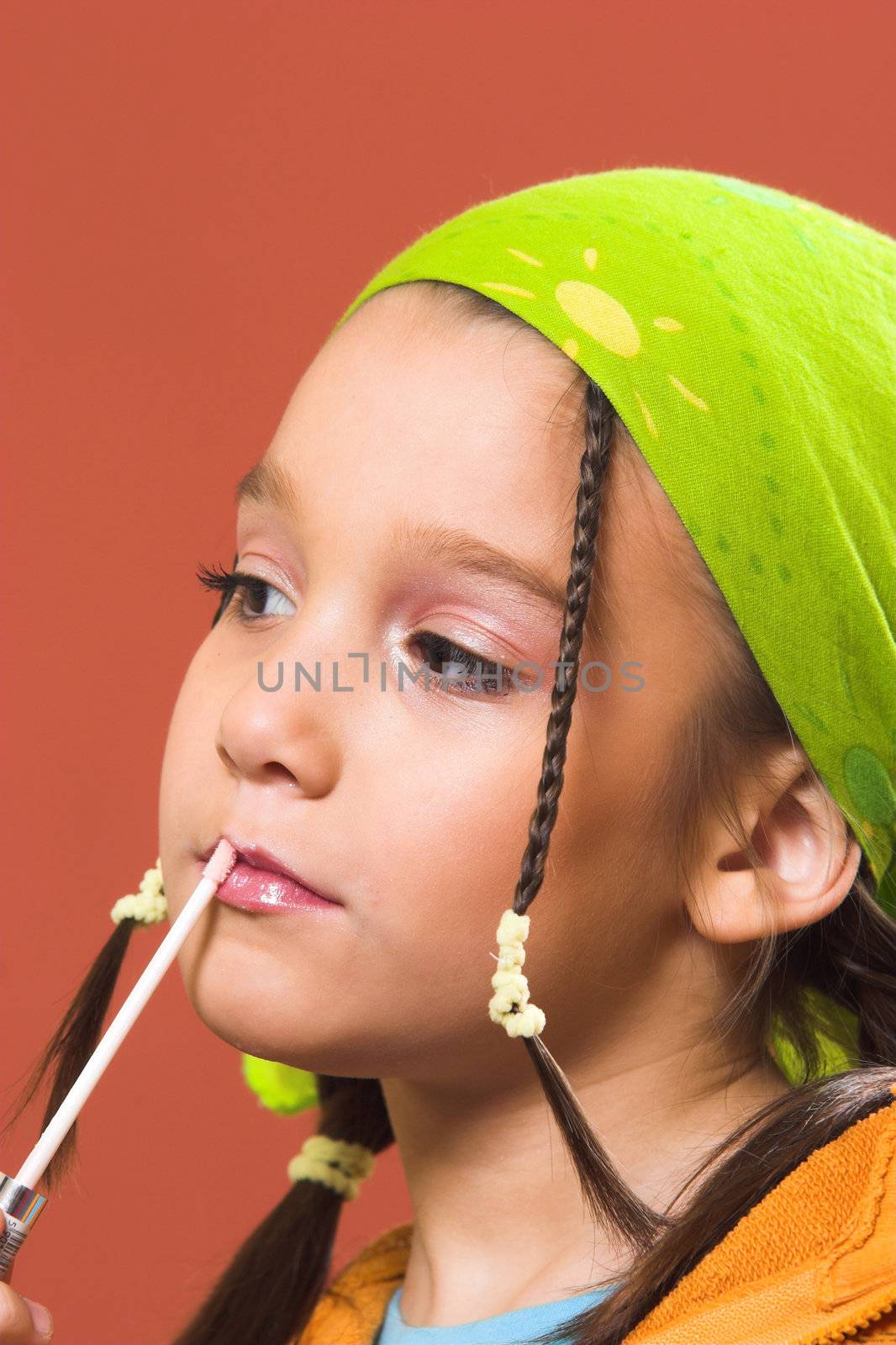 child applying make-up by vladacanon