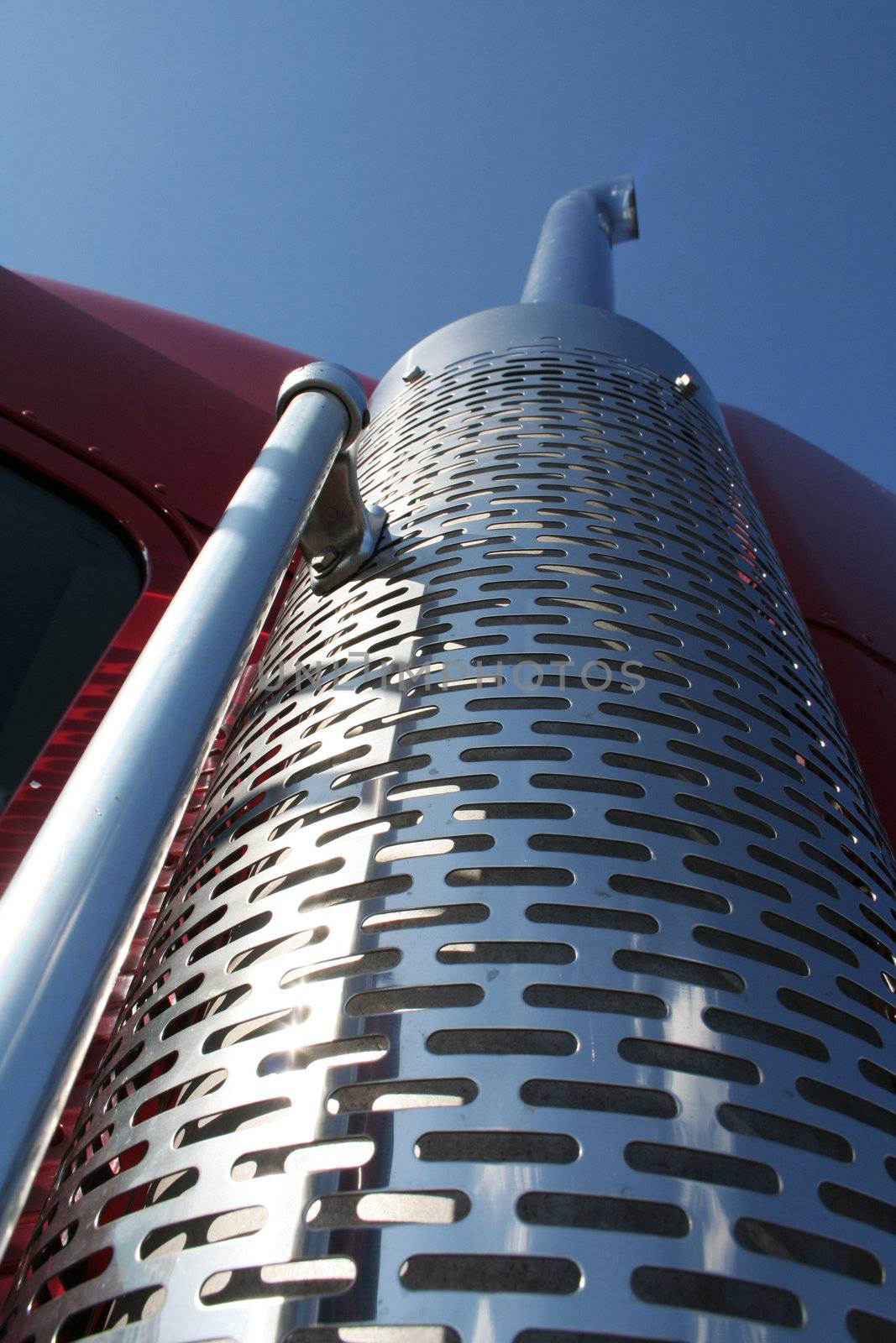 The beautiful red US Truck with chrome exhaust