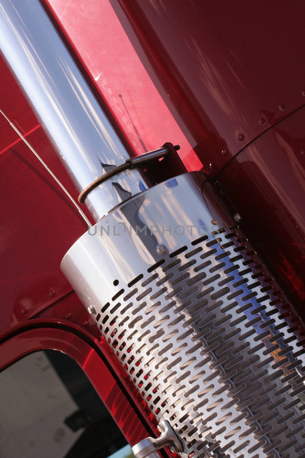 The beautiful red US Truck with chrome exhaust