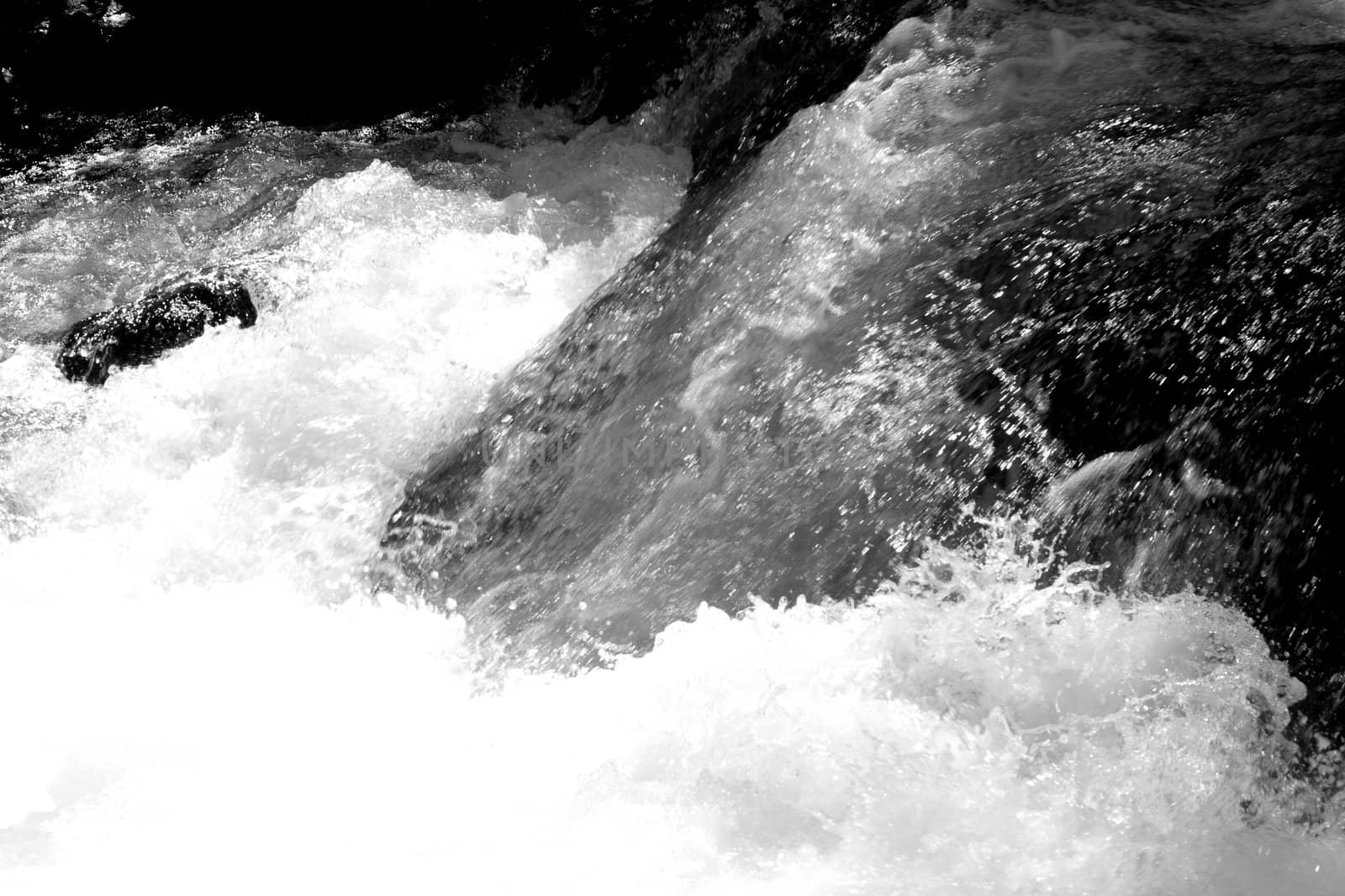 waterfall and stones in the stream 
