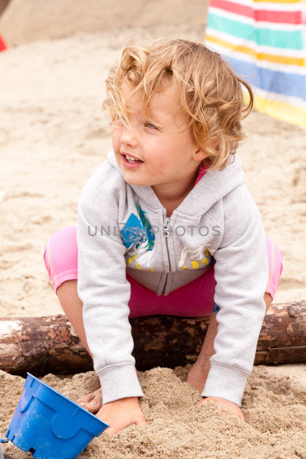 Having fun with sand on the beach.