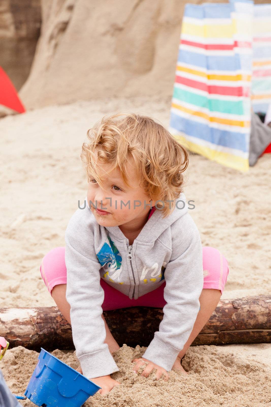 Having fun with sand on the beach.