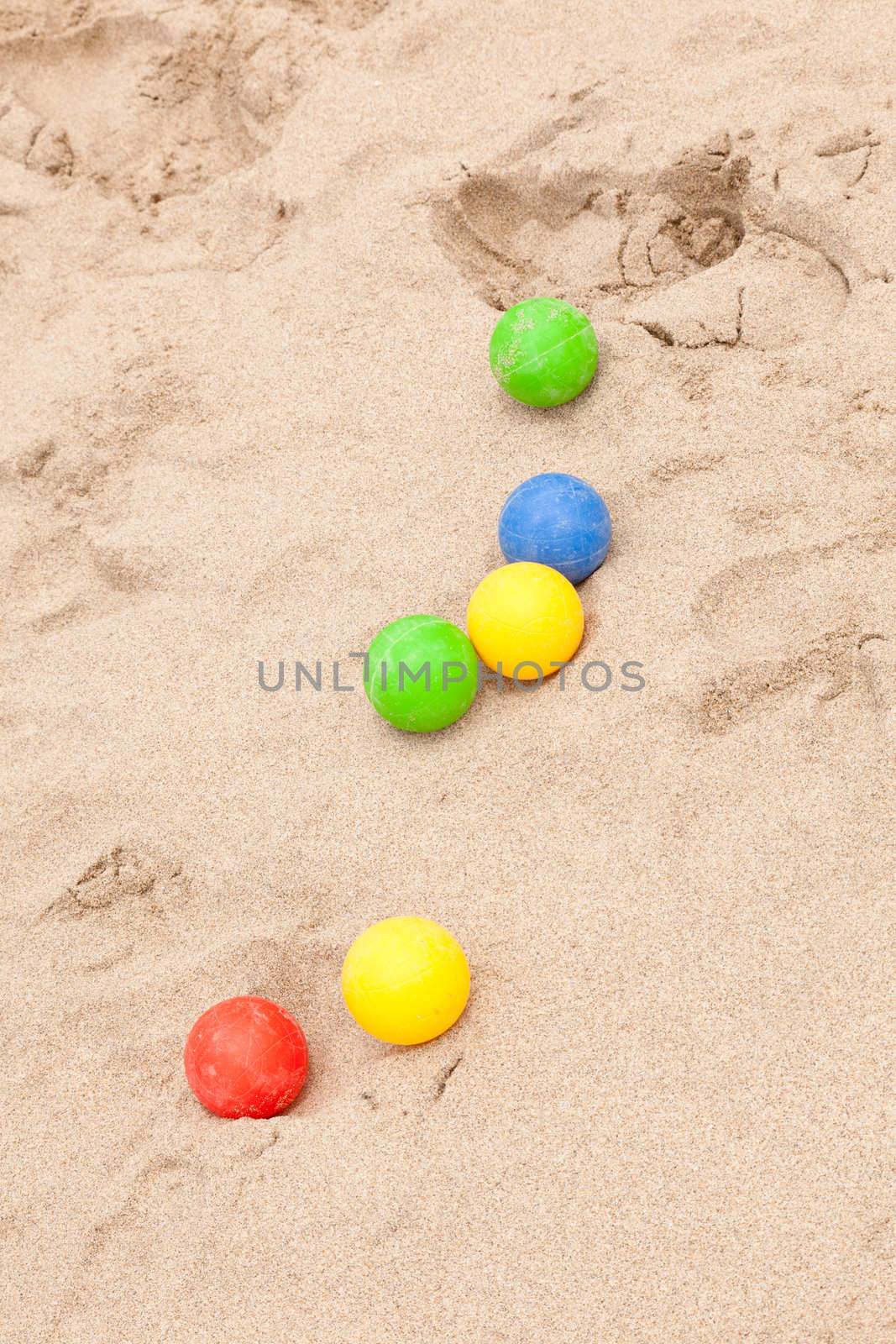 Colorful set of the bocce balls on sand.