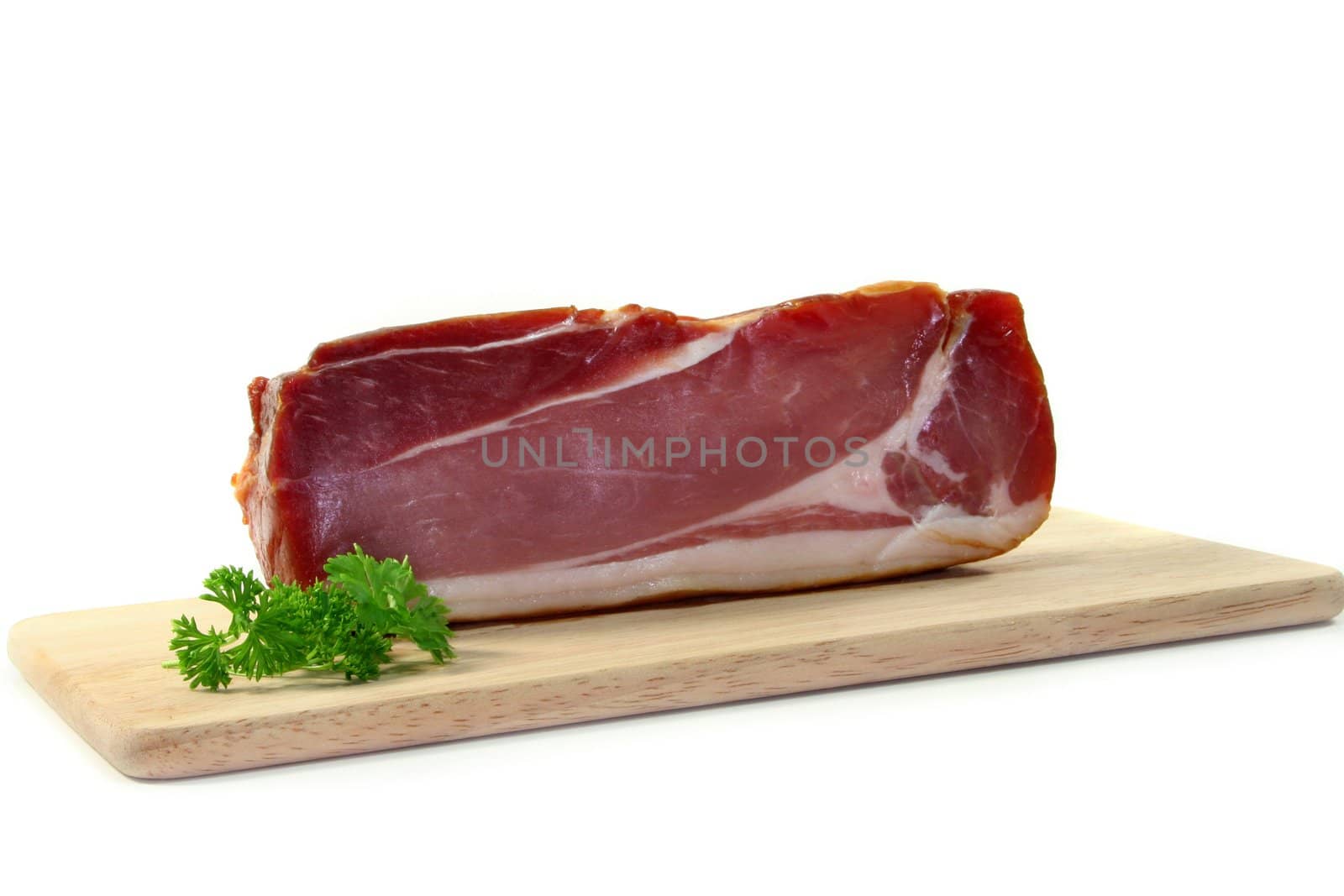 a piece of bacon on a wooden board