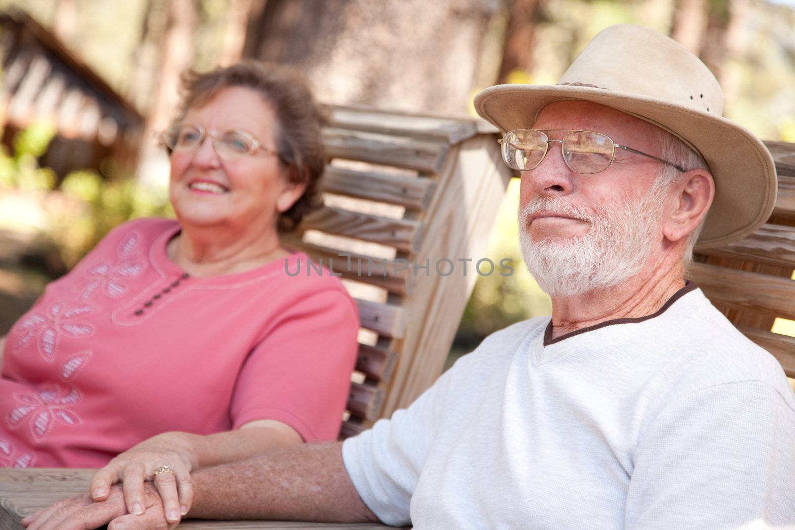 Loving Senior Couple Outdoors by Feverpitched