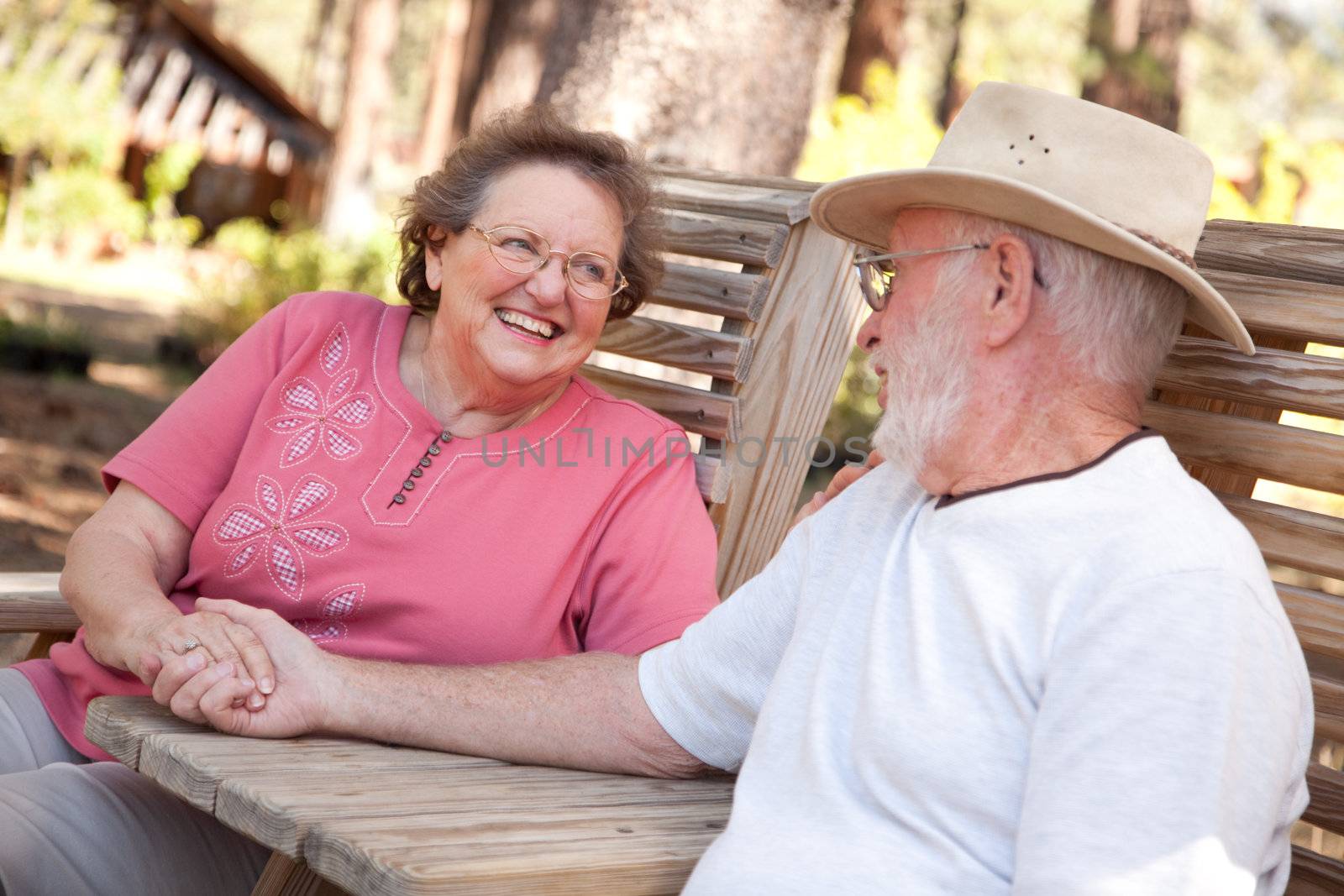Loving Senior Couple Outdoors by Feverpitched