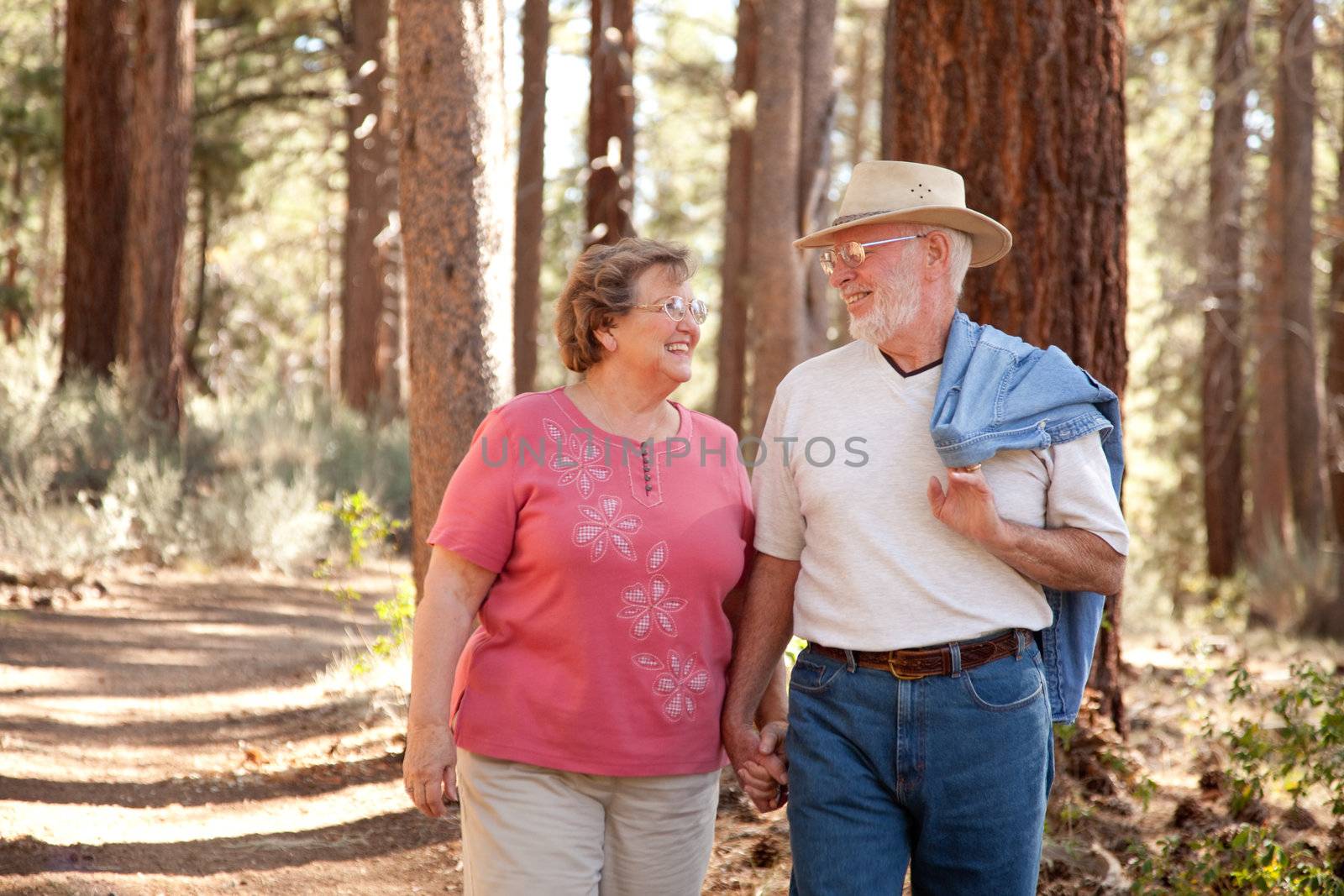 Loving Senior Couple Outdoors by Feverpitched