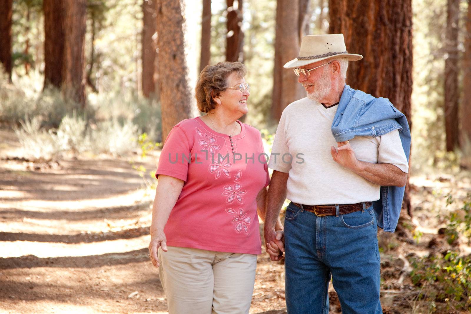 Loving Senior Couple Outdoors by Feverpitched