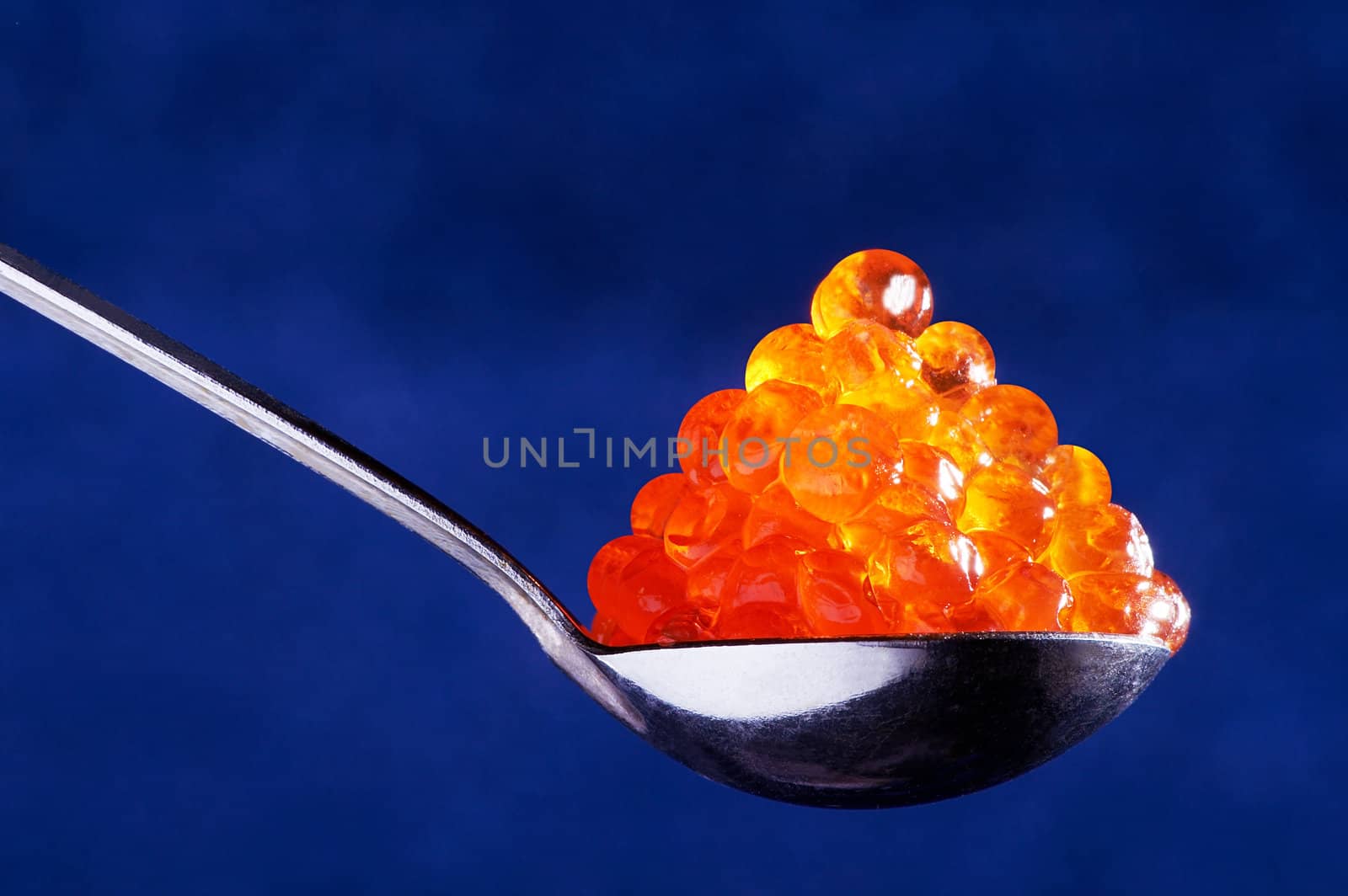 Red caviar in the spoon by terex