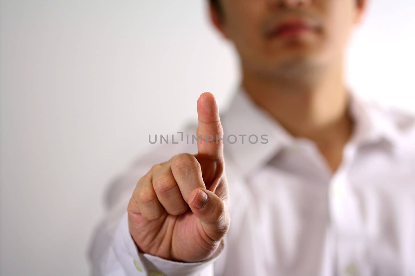 Businessman raising finger index