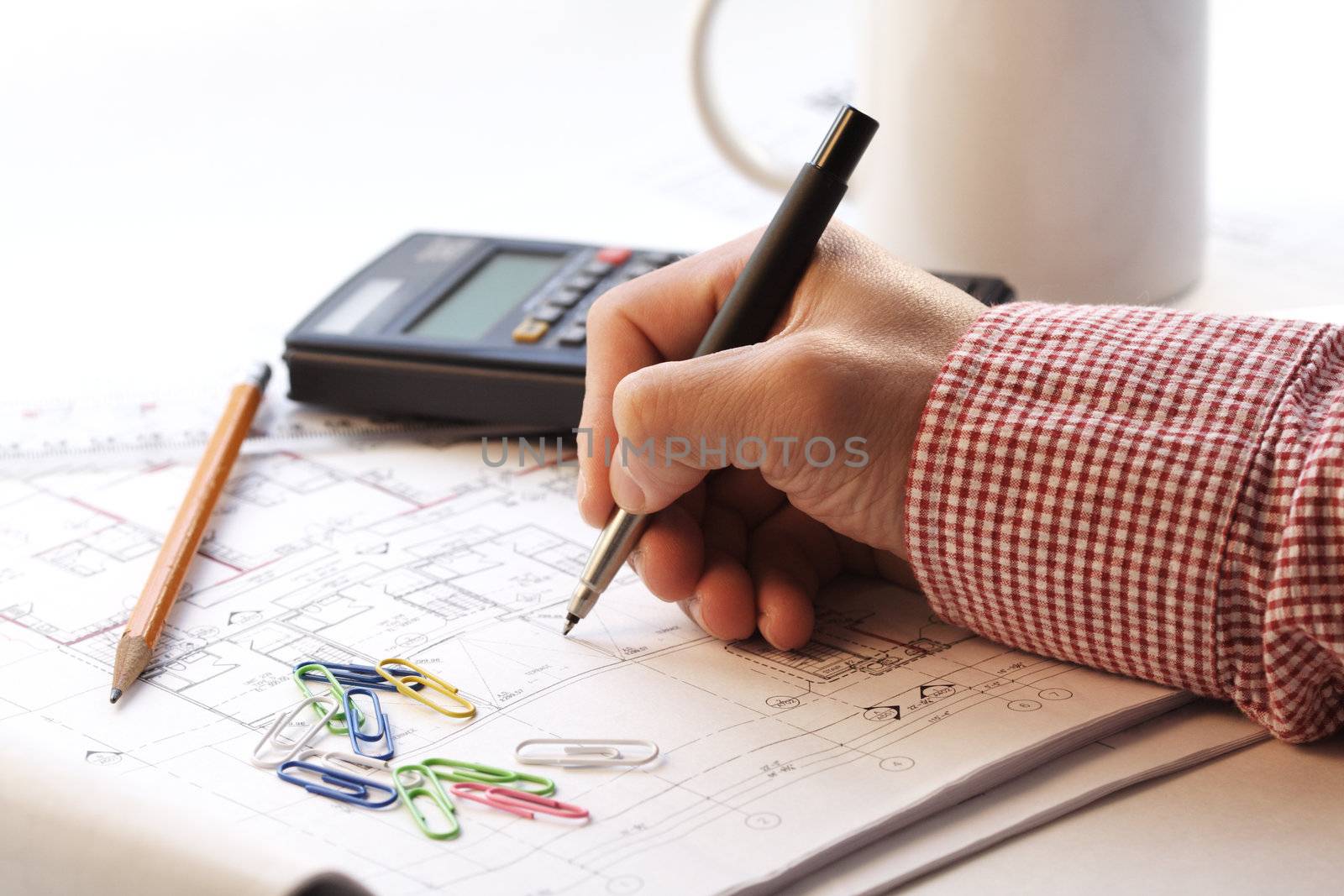 An architect working on a house blueprint