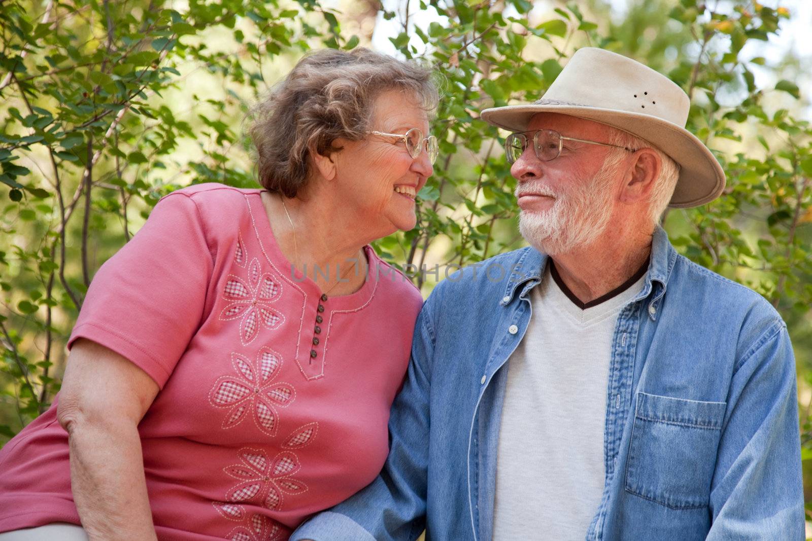 Loving Senior Couple Outdoors by Feverpitched