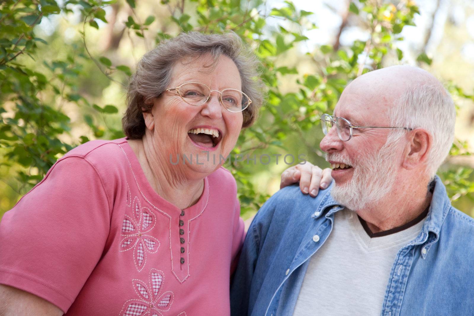 Laughing Senior Couple Enjoying the Outdoors Together.