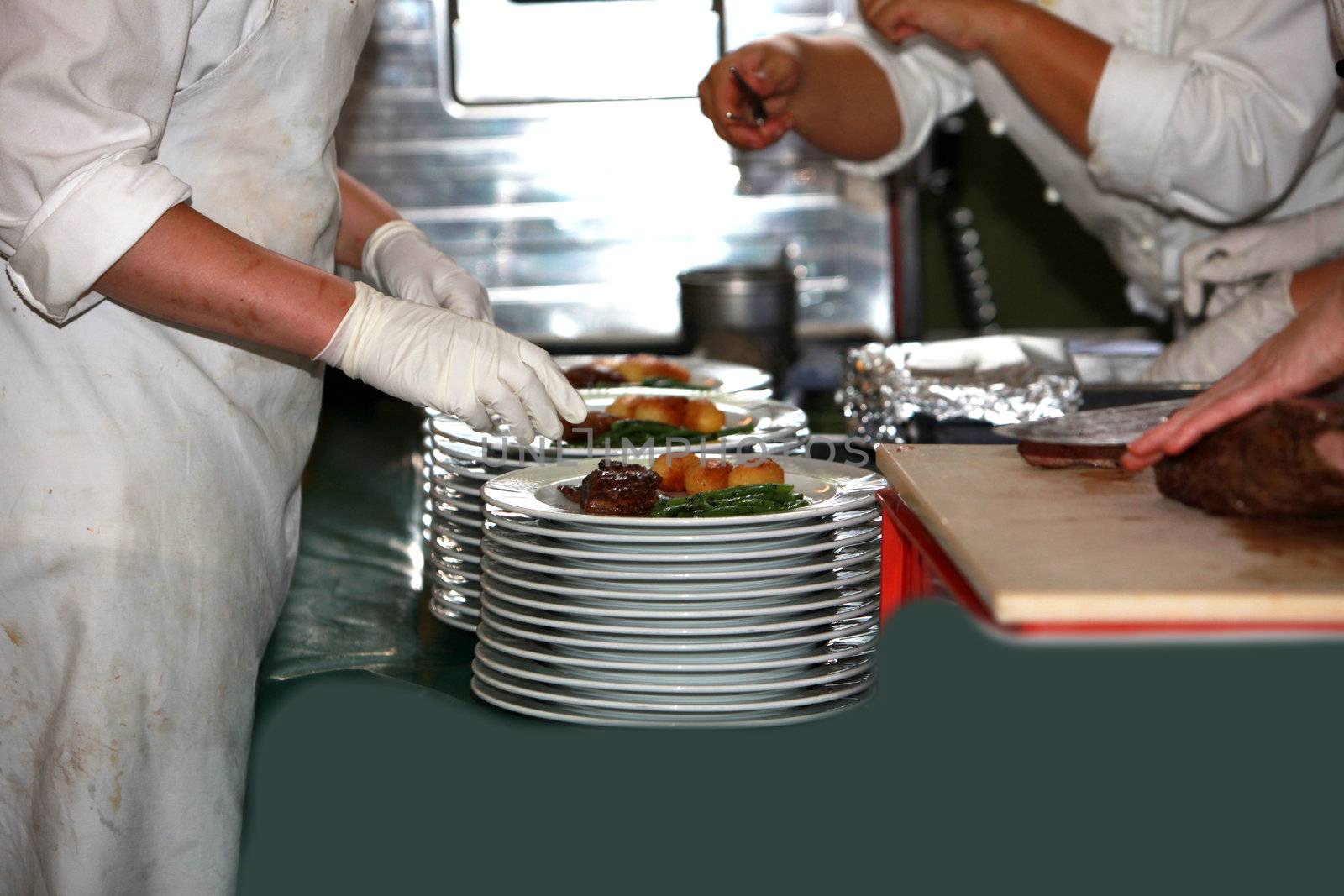 cooks in the preparation and decoration of food in kitchen