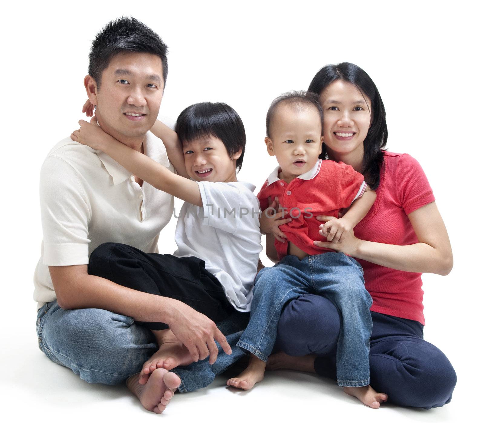 Happy Asian family sitting on white background