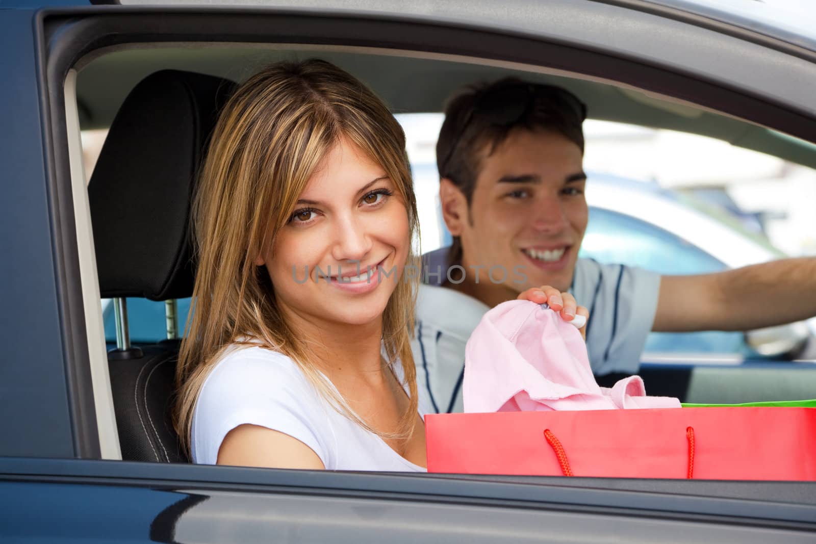 people in car after shopping by diego_cervo