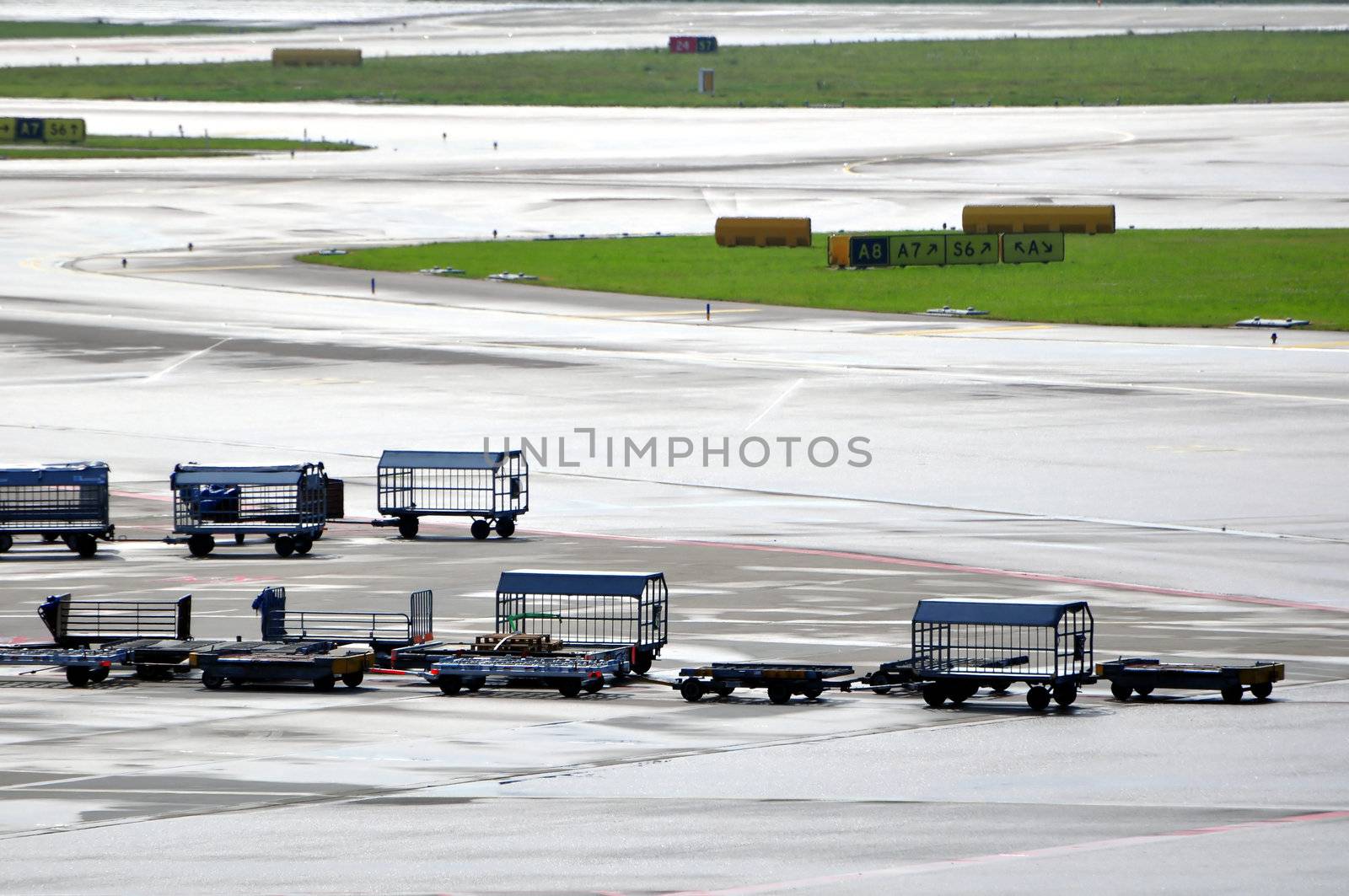 Cargo loading equipment at international airport ramp.