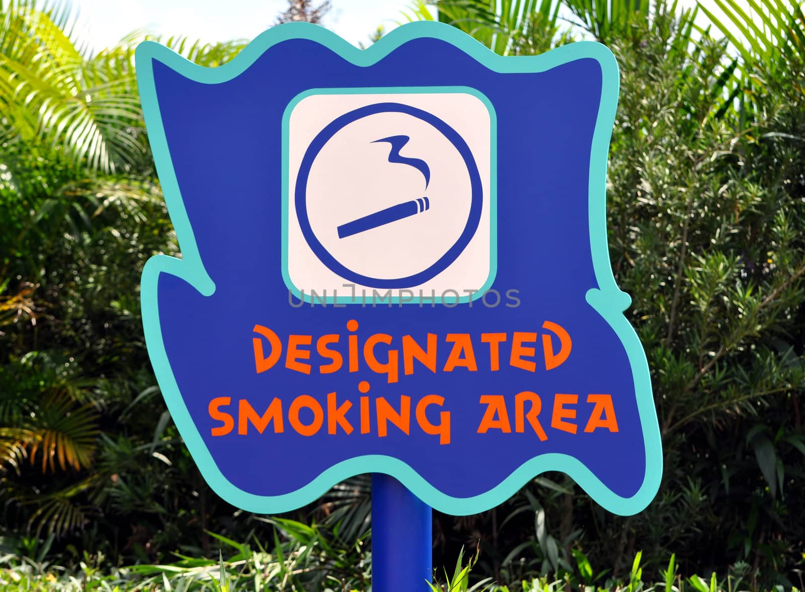 Designated smoking area sign at amusement park